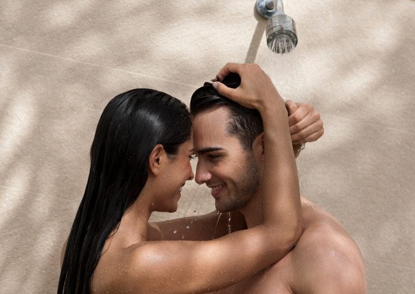Young lovers taking an shower.