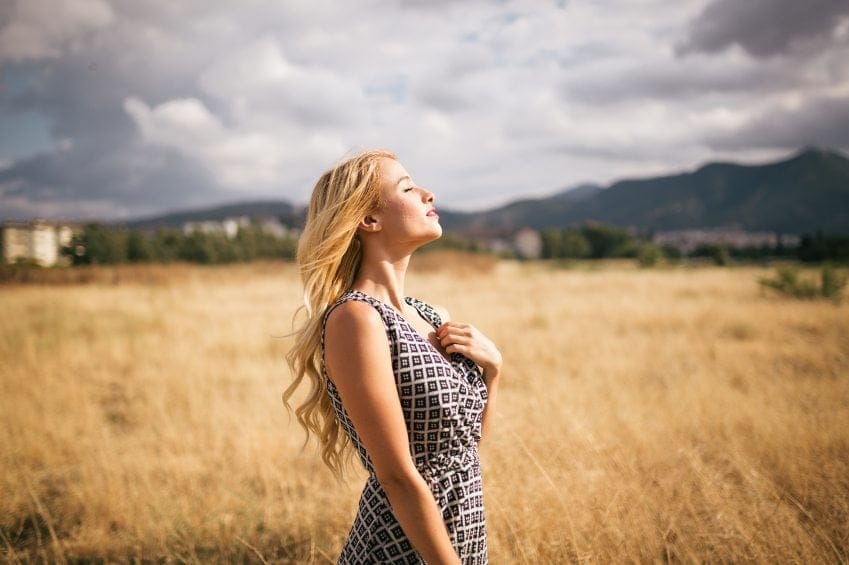 Young blonde woman in nature