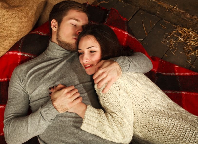 Loving couple embracing on cold floor
