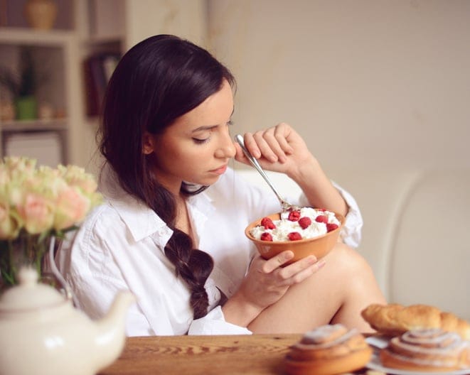 young woman having breakfast