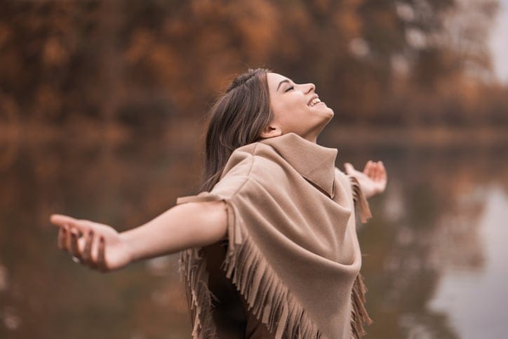 Carefree woman on the river