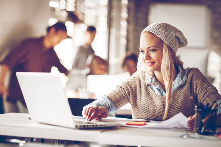 Young woman usign laptop in office