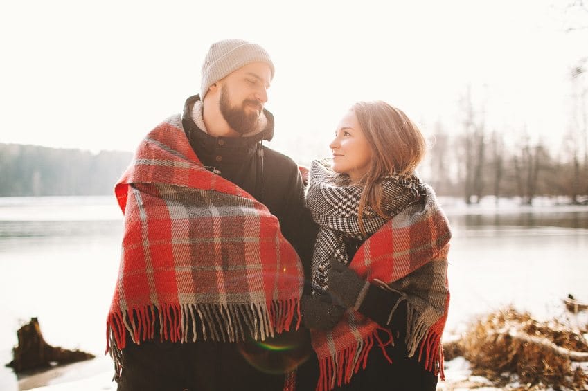 Couple wrapped in blanket