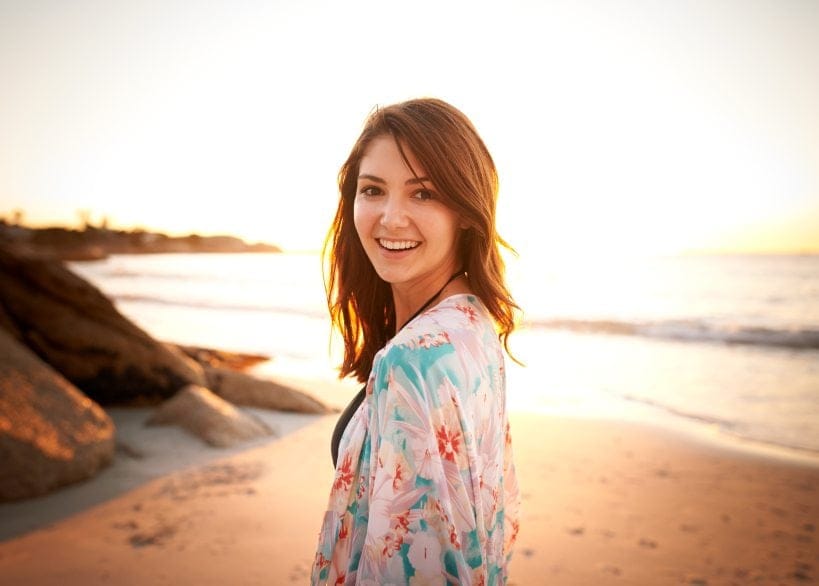dark haired woman on the beach