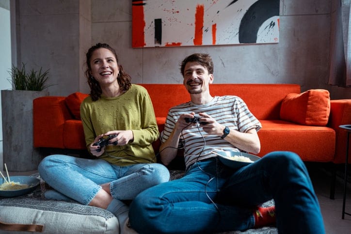 happy couple playing video games