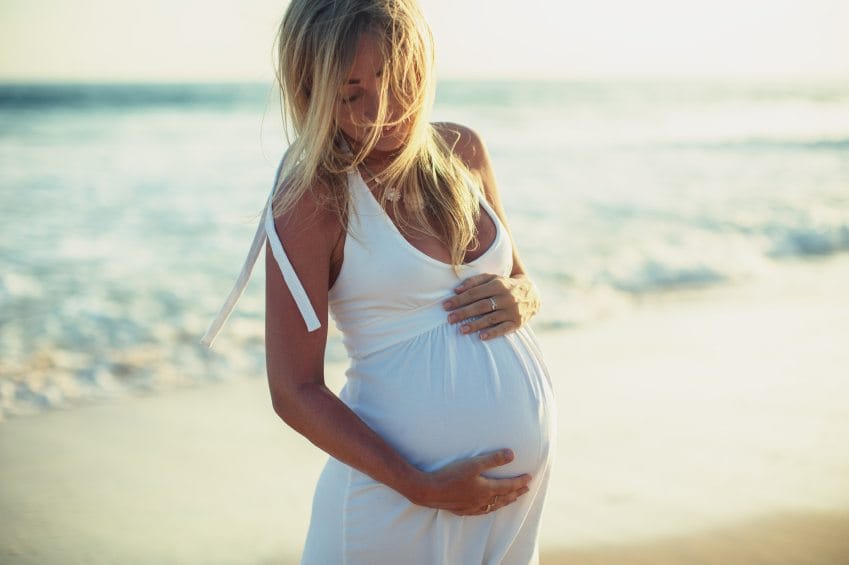 Pregnant woman on the beach