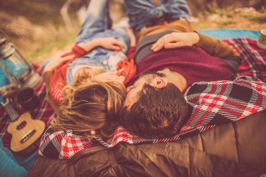 Couple camping outside