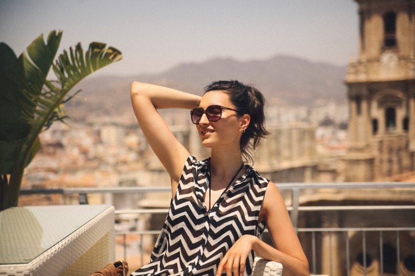 Elegant woman sat in the sun