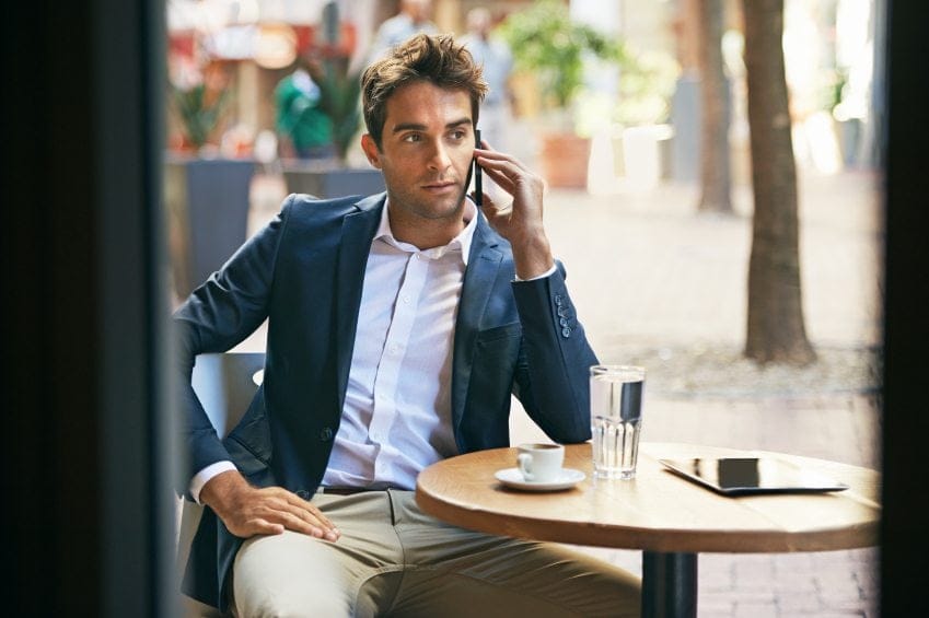 Smartly dressed guy having coffee