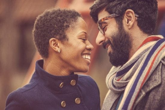 interracial couple smiling together