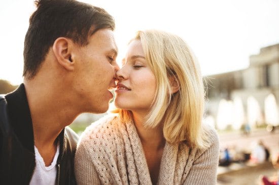 couple about to kiss outdoors