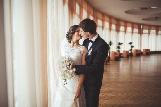 newlywed couple sharing kiss