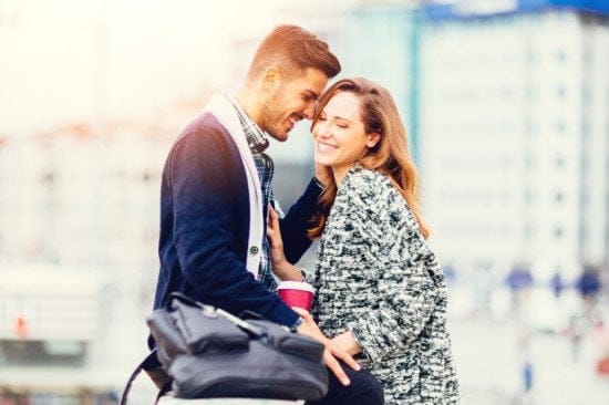 smiling couple in city center