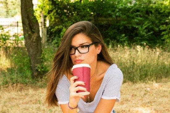 attractive brunette holding coffee
