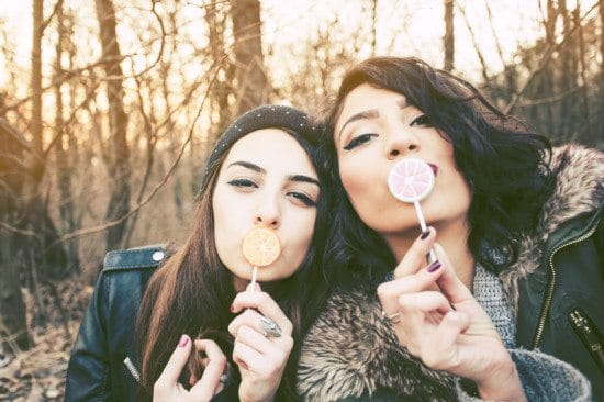 best friends in nature with lolipops