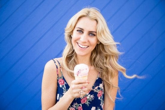 woman with ice cream blue background