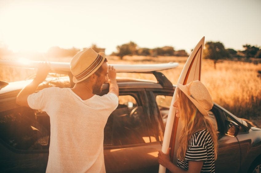 couple surfboards cars flirting sunset