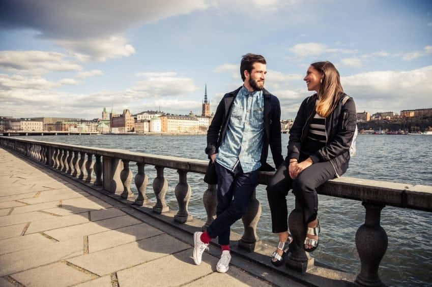 couple date beside water sunshine