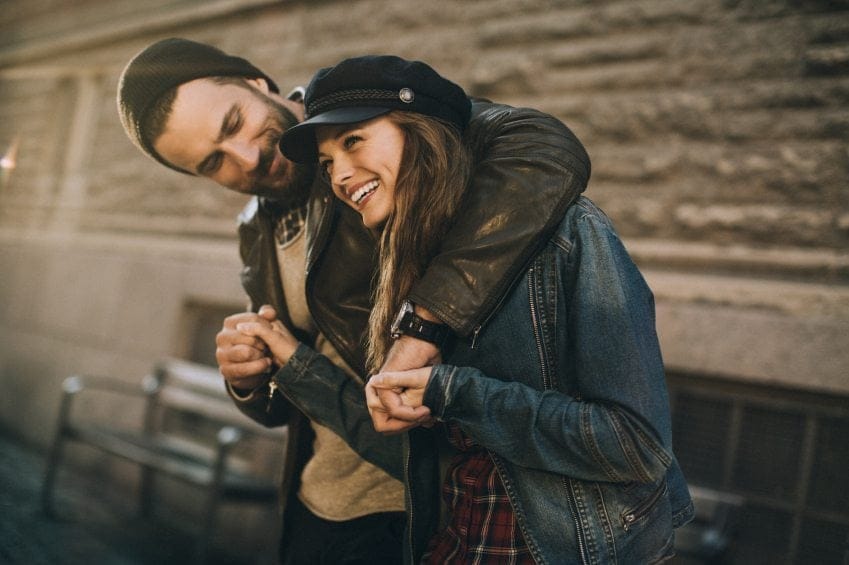 happy couple hugging outside