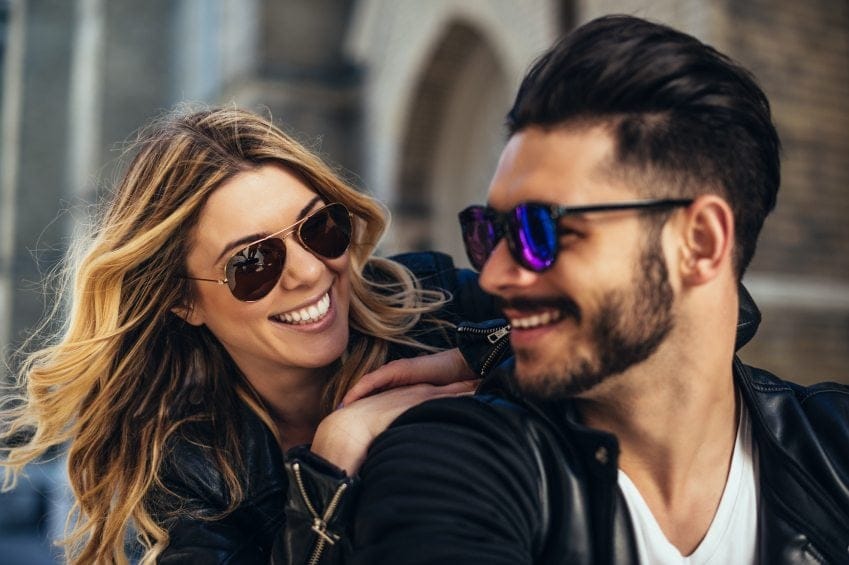 happy couple laughing street