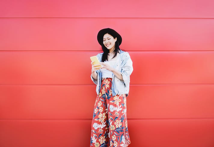 happy woman on phone outside