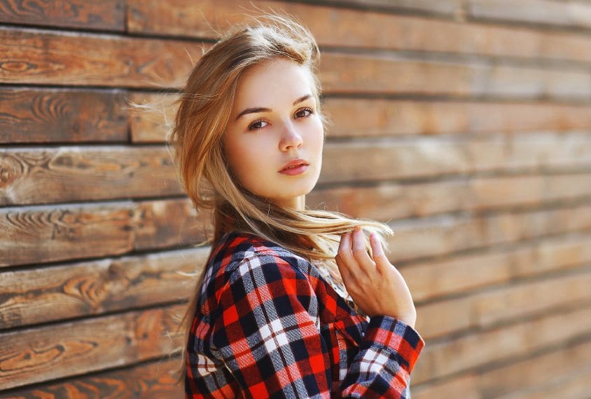 blonde woman in plaid shirt portrait