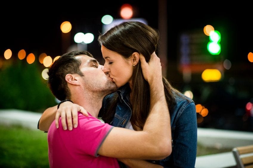 couple on date kissing at night