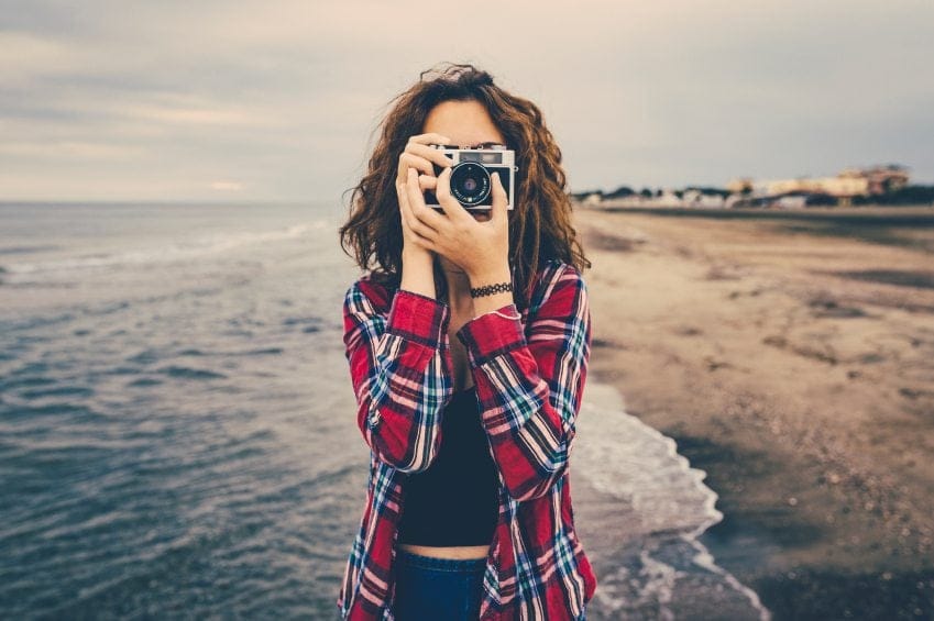 woman camera beach pictures
