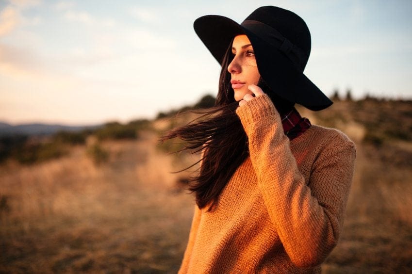 woman field hat sunset