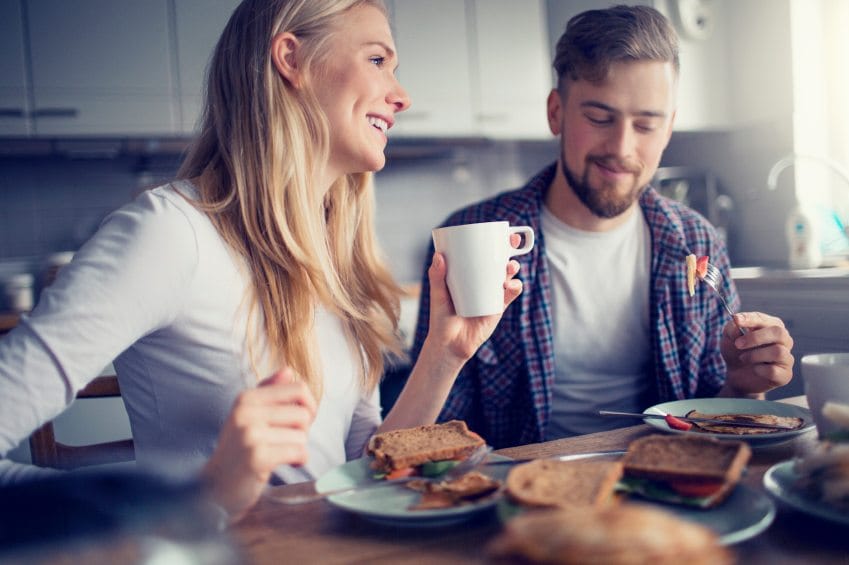 couple eating breakfast together at home
