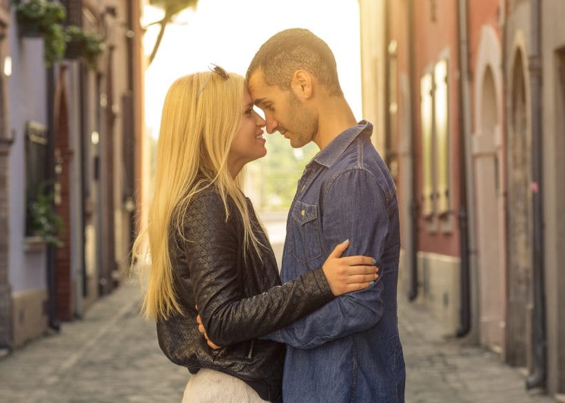 Couple in street about to kiss