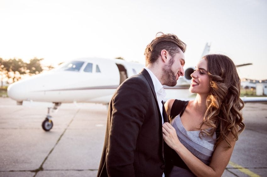 Guy going in for a kiss at the airport