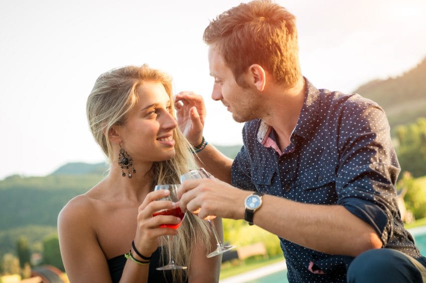 couple enjoy aperitif during the party