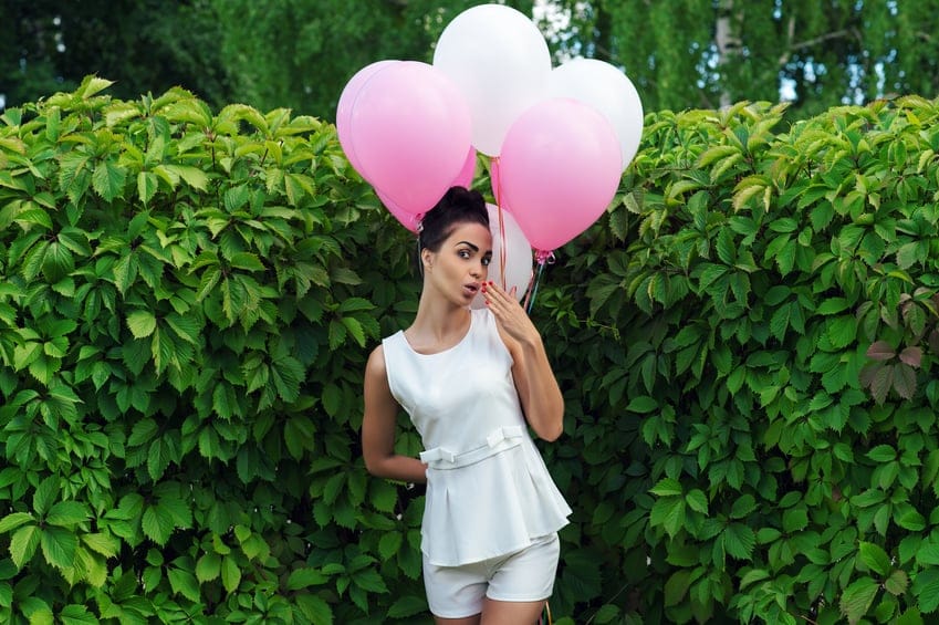 Woman holding pink.