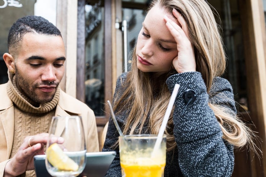 Couple at a Cafe with their digital tablet