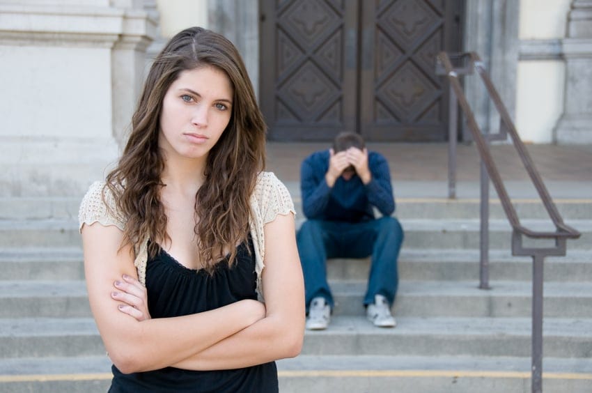 Unhappy couple steps