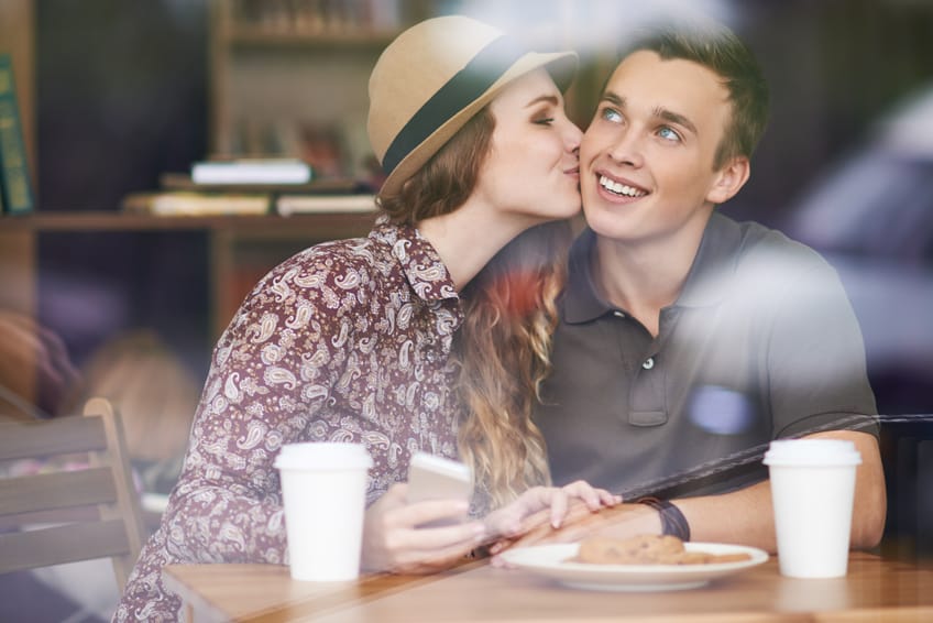 Couple sat in a cafe