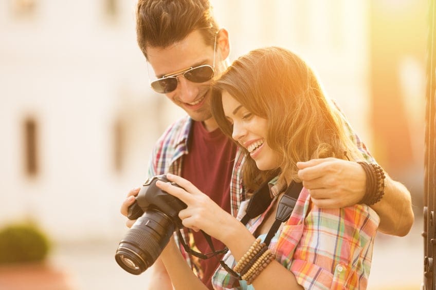 Young adult couple camera