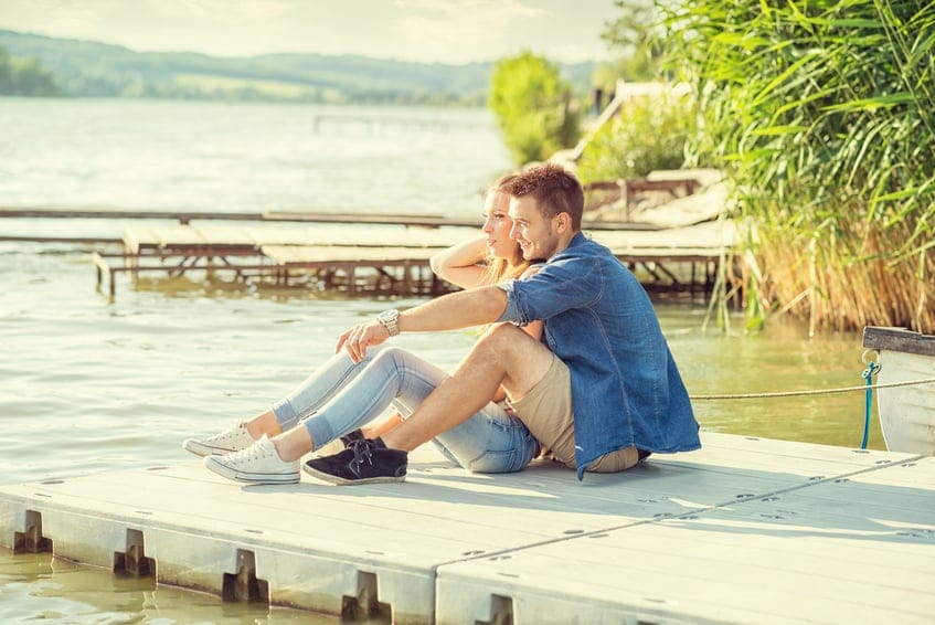 Couple sat near the pier