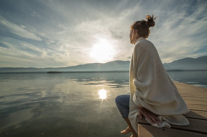 Young woman relaxing pier