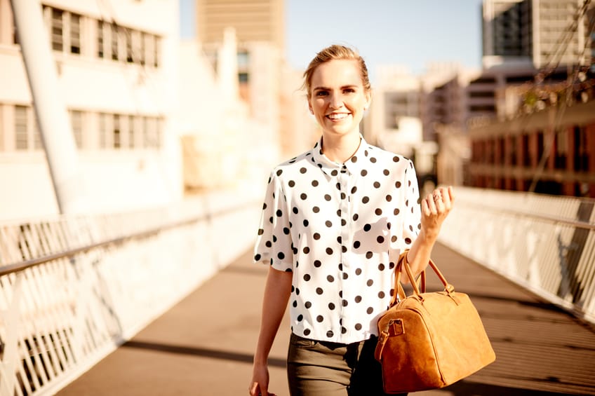 Young woman walking confidently