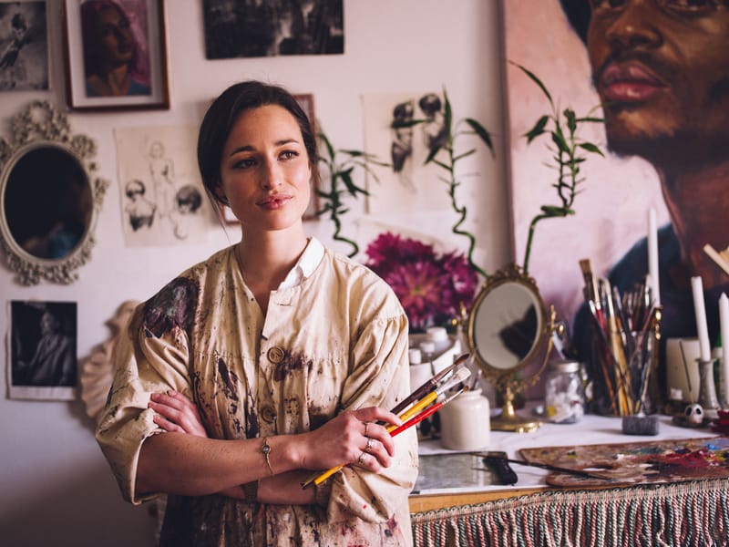 Woman painting in a creative art studio.