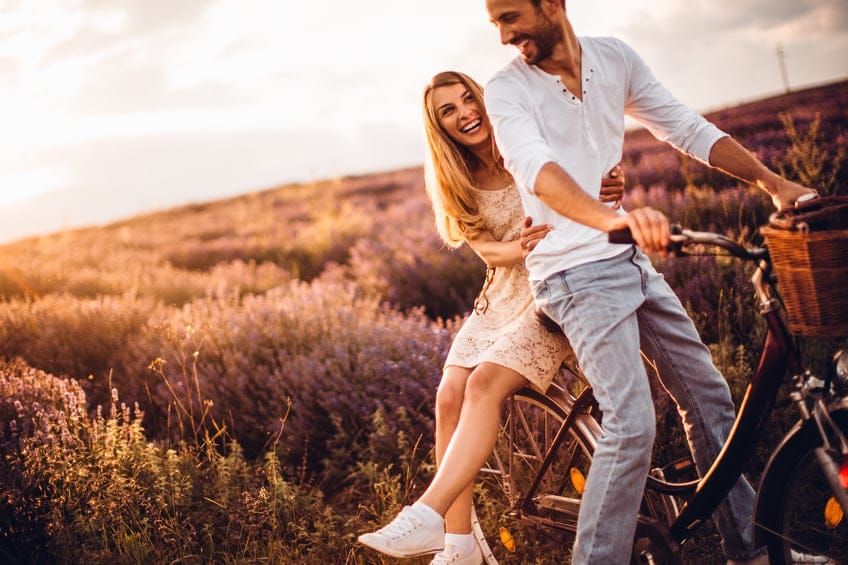 couple happy dating bike field