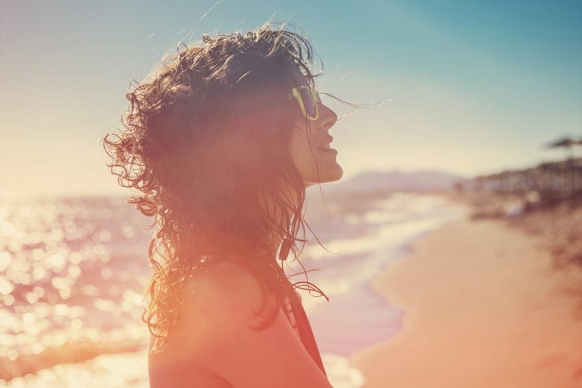 portrait of young beautiful woman on sunny summer day