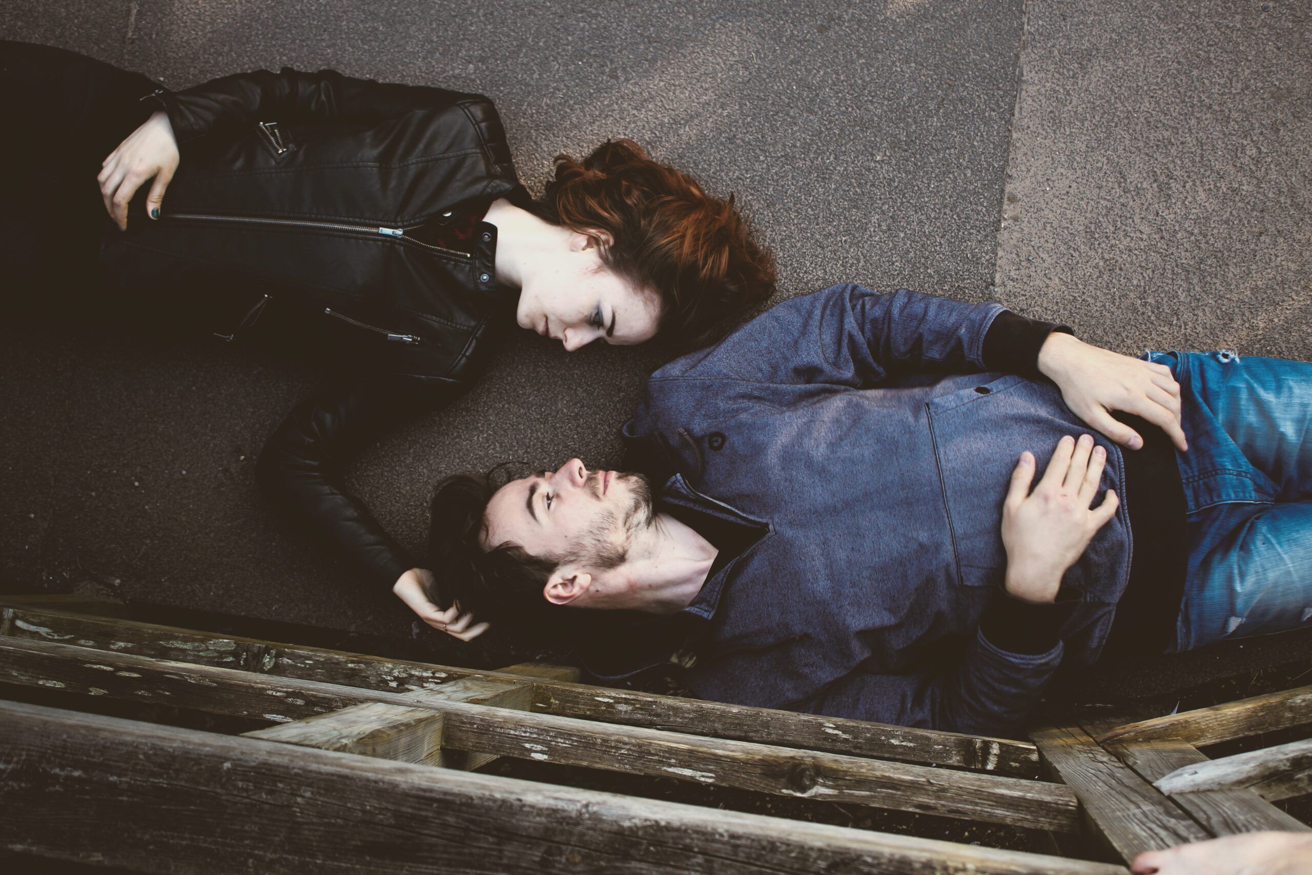 couple lying down street