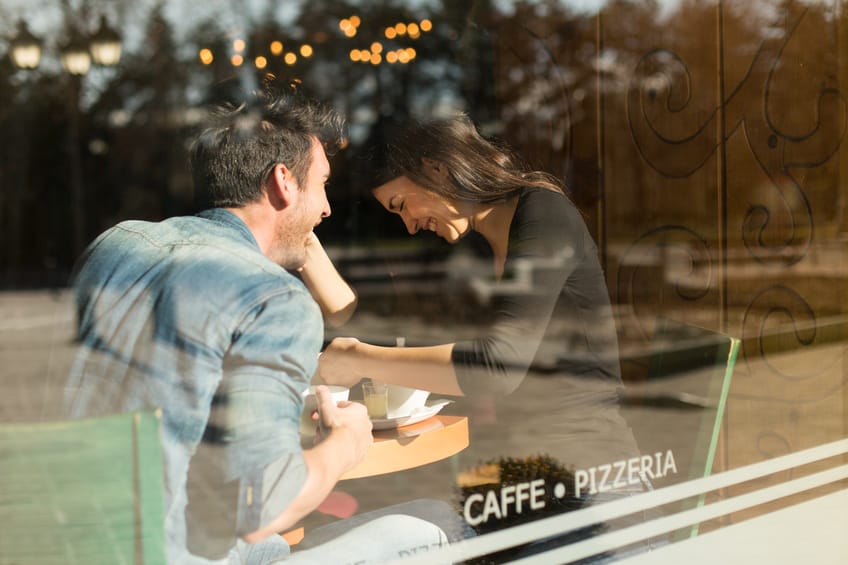 couple laughing tea restaurant date