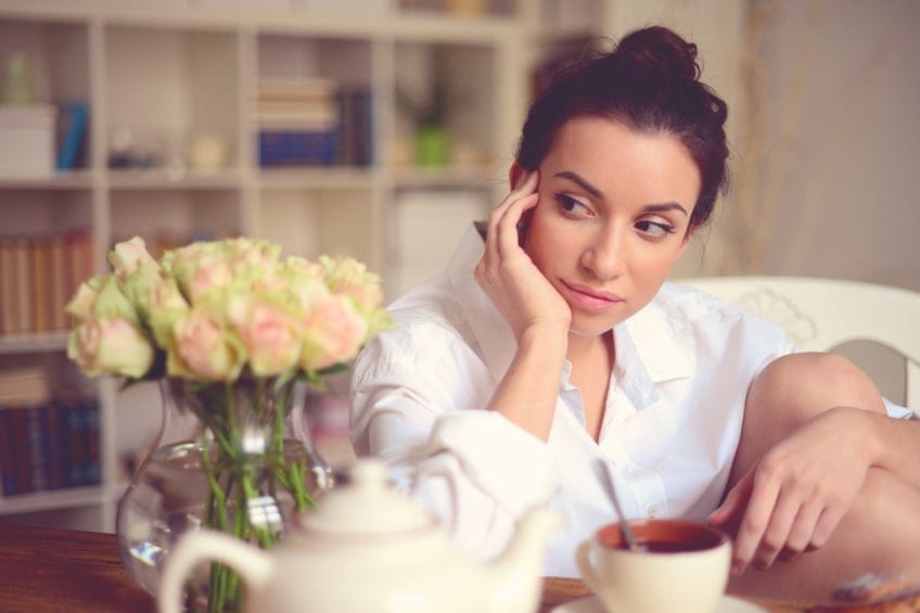 young brunette woman in home interior.