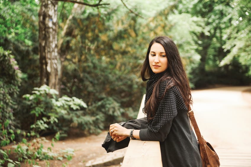 Vintage toned portrait of a young woman in Tiergarten park