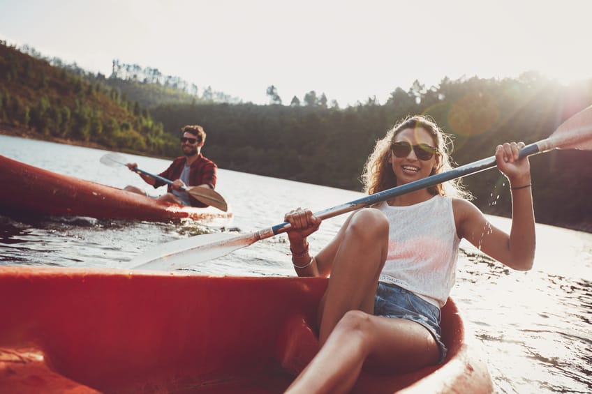 couple boats rowing summer fun