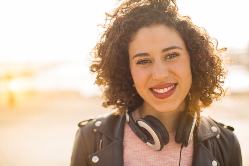 Woman wearing headphones.